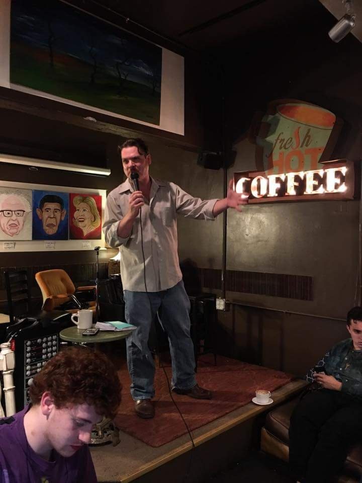 Bam performing at a coffee shop venue