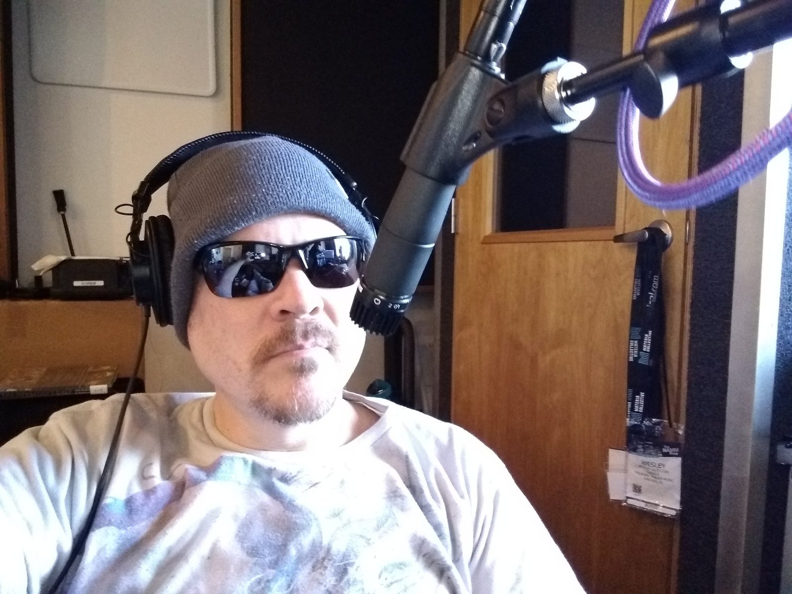 Bam in a radio studio with headphones