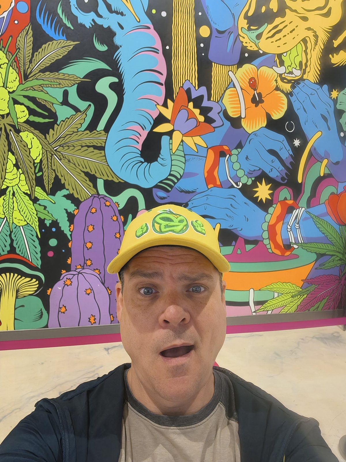 Bam in front of a mural